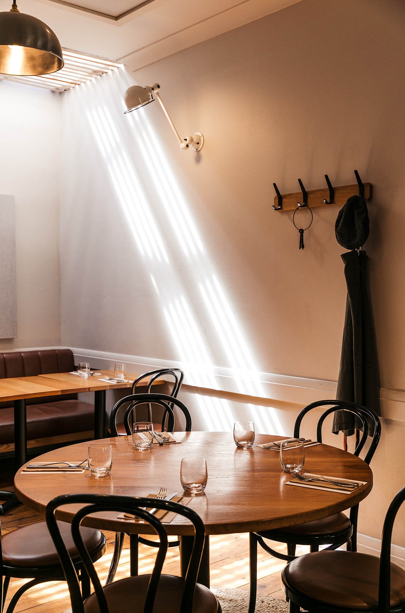 Photo of the interior of the restaurant, with a table set-up for dinner