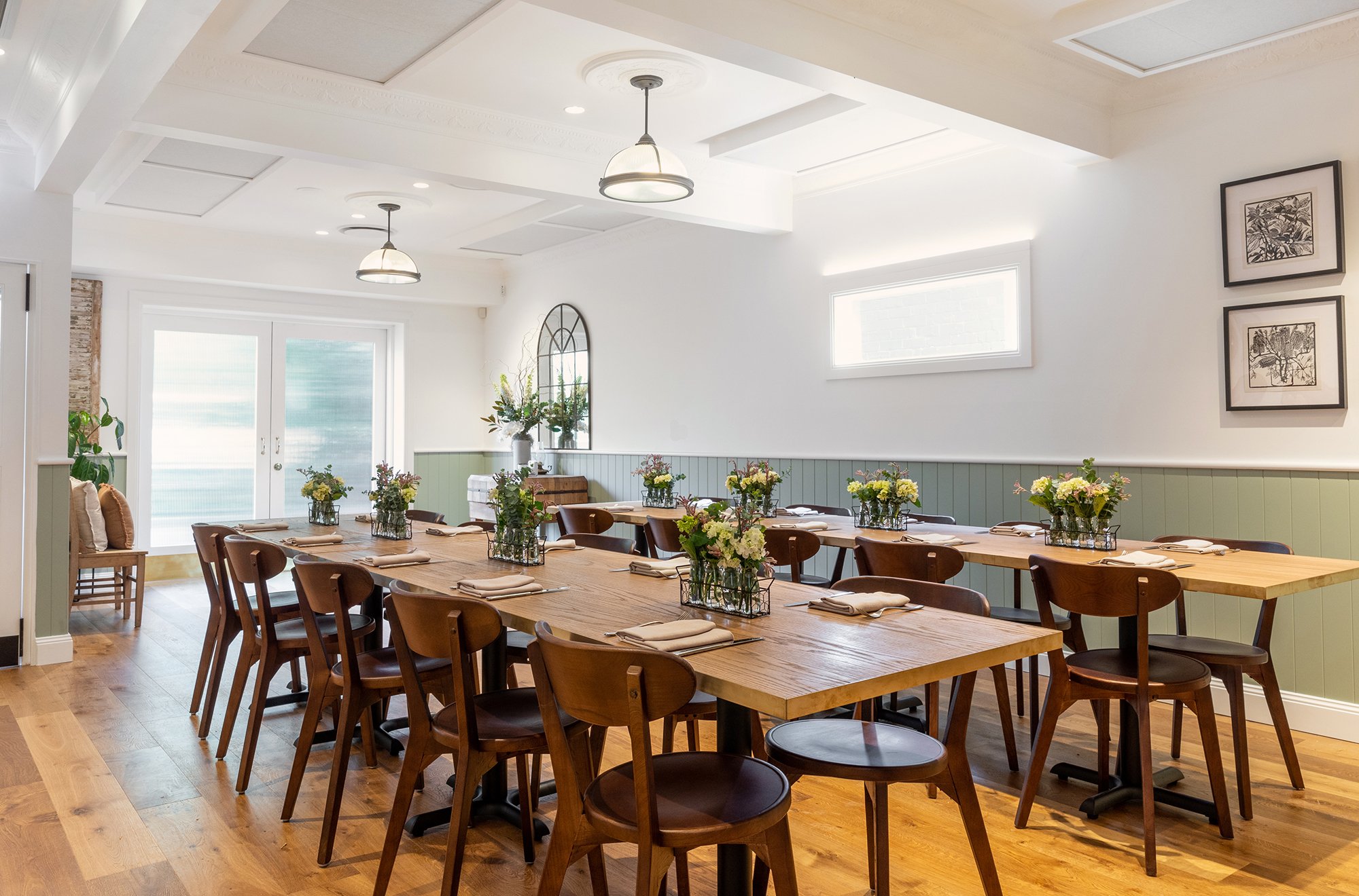 Photo showing the full restaurant layout with tables set up banquet style suitable for function bookings